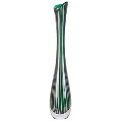 a green and white striped glass vase on a white background with clipping for text