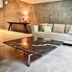 a living room with a marble coffee table