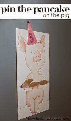 a paper cut out of a pig with a birthday hat on it's head