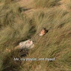 an old man laying in the grass with his eyes closed and texting me, my playlist, and my self