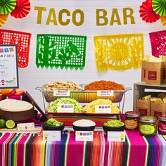 taco bar with mexican food and decorations