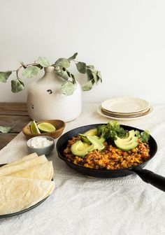 the meal is ready to be eaten and served on the table with tortillas