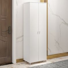 a white cabinet next to a brown door in a room with marble floors and walls