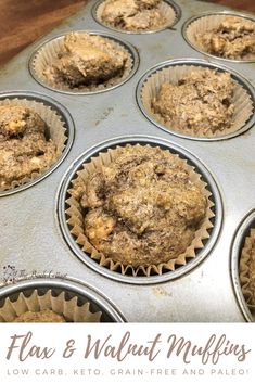 a muffin tin filled with cupcakes sitting on top of a wooden table