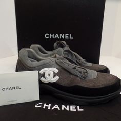 These Are In Really Good Condition, Clean, No Odors. Super Attractive Pair Of Channel Athletic Shoes. These Are A Size 9 & Come With Box, Customer Care Card & One Dust Cover. Please Feel Free To Ask Questions. I Know With High End Designer Purses, Get Sent To Pm Headquarters For Authentication. So They May Be A Little Longer To Receive. (Its A Great Service And Protects Buyer And Seller) Buy 4 Plus Items And Receive A 15% Discount And Save Over $21.00 On Shipping. Check Out Our Closet Designer Gray Lace-up Sneakers, Luxury Gray Sneakers With Round Toe, Luxury Gray Round Toe Sneakers, Designer Gray Sneakers With Round Toe, Designer Purses, Grey Suede, Care Card, Purses Designer, Chanel Black