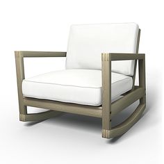 a white chair sitting on top of a white floor next to a wooden frame and cushion