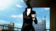 a woman in a black dress holding a coffee cup