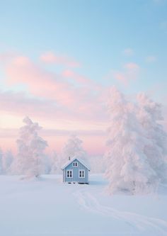 a house in the middle of a snowy field with snow covered trees and pink sky