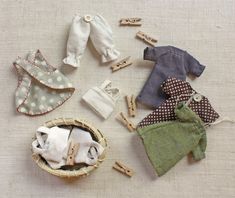 an assortment of clothing and clothes pins laid out on a table