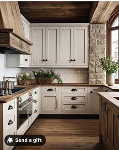 a kitchen with white cabinets and wood flooring is featured in this ad for the home depot