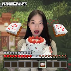 a woman holding a cake with strawberries on it in front of a video game screen