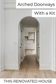 an empty room with white walls and wood floors, the door is open to reveal a kitchen