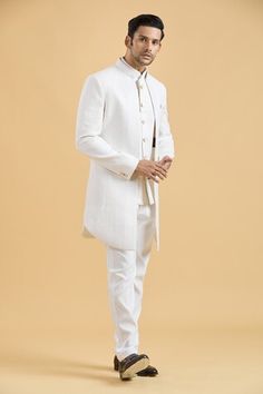 Off-white sherwani featuring thread embroidery all over. Paired with a bundi and a pant. - Aza Fashions White Nehru Jacket With Traditional Drape For Groom, White Nehru Jacket For Groom With Traditional Drape, White Kurta With Zari Work For Groom, White Nehru Jacket With Zari Work For Groom, White Zari Work Kurta For Groom, White Nehru Jacket With Dabka For Groom, Festive White Groom's Set, Festive White Sets For Groom, White Nehru Jacket With Naqshi For Diwali