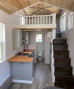 the interior of a tiny house with stairs