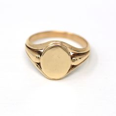 Classic vintage circa 1940s era 10k yellow gold blank signet ring! This amazing signet ring has a blank oval center, that is ready to be monogrammed or left as is. Each shoulder has unique open metal designs, and the shank is free of design. A lovely piece of fine unisex style vintage jewelry, that is ready to be personalized! *Sale - price reduced from $725 USD to $710 USD.  If you would like the signet ring as is, un-engraved, please type "N/A" in the "Add Your Personalization" field on the right. CUSTOMIZED PIECES - This ring is eligible for our engraving services! All engraving options can be seen in last photo of listing. Please note that customized pieces take 2-3 weeks to be engraved by our talented jeweler. Customized pieces are considered final sale. Please select your font choice Classic Fine Jewelry, Logo Gifts, Gold Signet Ring, Lancaster Pa, Signet Rings, Metal Design, Ring Vintage, Signet Ring, Classic Vintage