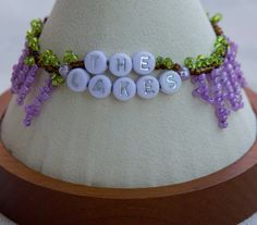 the cake is decorated with grapes and beads