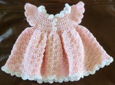 6 - 9 months  button up back made with very soft pink and white yarn with a purple flower. Cute Pink Crochet Dress, Baby Girls Dresses, Crochet Baby Dress, Purple Flower, Crochet Dress, Pink And White, Baby Dress, Purple Flowers