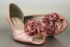 "Dress up your trip down the aisle with these 1 3/4\" d'orsay style kitten heel peep toe custom wedding shoes (measured like this: http://www.customweddingshoe.com/about-ellie-wren/heel-height-measurement/). These custom wedding shoes are shown here in antique pink and feature a trio of handmade antique pink flowers on the toe. The large flower is accented with a silver crystal adornment. Color Change: Want this shoe in a different color? We can change the base shoe color for you! To order this Wedding Shoes Pink, Pink Bridal Shoes, Flower Wedding Shoes, Kitten Heel Wedding Shoes, Wedding Wedges, Custom Wedding Shoes, Pink Wedding Shoes, Heels Pink, Kitten Heel Shoes