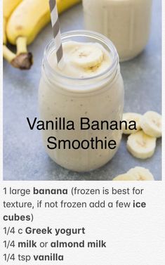 a banana smoothie is in a jar with a straw and two bananas on the side