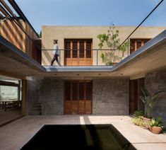 an indoor swimming pool in the middle of a house