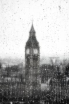 the big ben clock tower towering over london on a rainy day