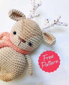 a crocheted stuffed animal with a pink scarf around its neck and the words free pattern below it