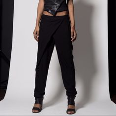 Look Beautiful In These Gorgeous Black Pants Featuring Cross Over Detailing At Zip/Hook Closure And Pockets At Waist And Back. Loose Fit, Unlined. Edgy Spring Trousers, Spring Edgy Pants, Fitted Chic Harem Pants For Fall, Summer Tapered Leg Pants For Night Out, Chic Fitted Harem Pants With Pockets, Versatile Straight Pants For Night Out, Edgy Straight Pants For Spring, Edgy Spring Straight Pants, Chic Fitted Harem Pants Ankle-length