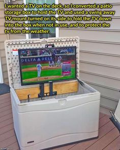 an ice chest with a baseball game on the tv screen in it's back