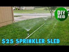 a sprinkler is spraying water on the lawn