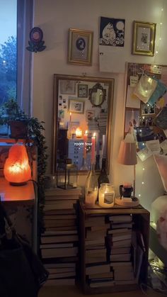 a room filled with lots of books and candles