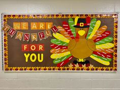 a bulletin board that says we are grateful for you with a turkey and pilgrim hat on it