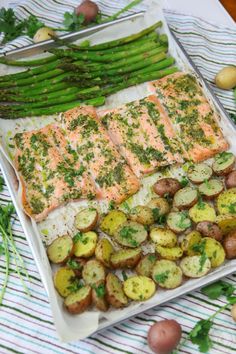 salmon, potatoes and asparagus on a platter ready to be served for dinner