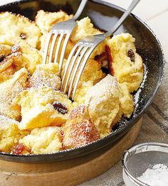 a close up of a pan with food and a fork