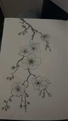 a drawing of some flowers on a piece of paper