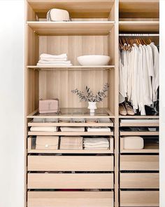 an organized closet with drawers and shelves filled with clothing, shoes, and other items