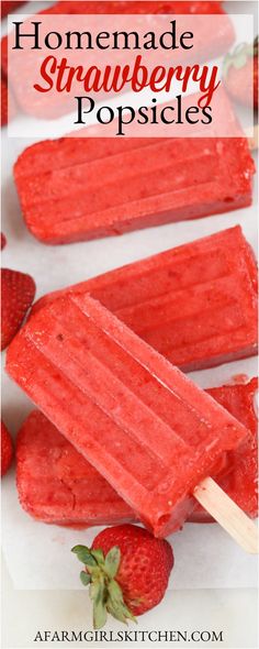 homemade strawberry popsicles with strawberries on the side