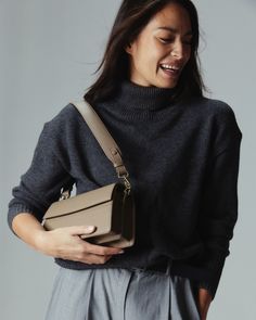 A miniature version of a classic shoulder bag, with every bit of the functionality. Perfectly proportioned with two interior compartments and a zip divider to hold all your essentials. Detachable long strap effortlessly converts into a crossbody. Handcrafted from our soft pebbled vegan ultrafiber leather. Shoulder Bag Black, Mini Shoulder Bag, Minimal Design, Vegan Leather, Bags Designer, Divider, Shoulder Bag, Leather, Black