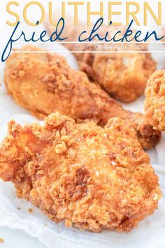 the cover of southern fried chicken, featuring three pieces of fried chicken on parchment paper