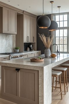 a large kitchen with an island in the middle