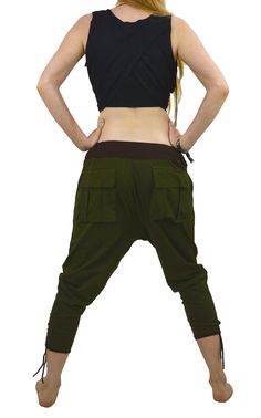 Stretchy Afghan 2 pocket pants.  These are now back in stock, they are a super comfy and cozy legging. Ideal for just hilling out in , Loose and stretchy with tewo big bag pockets and tie up ankles. Made from stretch cotton (lycra) making them super flexible and very unusual.   Elasticated waist band and soft waist band with stretchy easy fabric and  pockets at the back.  Tie up gathered and pleated anklets make these pants a super unique design.     █ FABRIC - Made from a cotton/lycra blend.   █ SIZE - fits from UK 6 to 14 (USA 4 to 10) █ ASSORTED COLOURS- Greens    █ MATCHES -    And they look fabulous with our Sprite top or our Elfin Pixie top   █  DISCOUNTS ON MULTIPLE SHIPPING -   Additional items are always much cheaper-WE WILL SHOW YOU THE TOTAL SHIPPING PRICE BEFORE YOU MAKE YOUR P Harem Bottoms With Pockets For Fall, Fall Harem Bottoms With Pockets, Loosely Fitted Harem Pants For Fall, Hippie Style Cotton Pants For Fall, Baggy Harem Pants With Side Pockets, Baggy Full-length Harem Pants With Pockets, Baggy Harem Cargo Pants, Relaxed Fit Pants For Fall Festival, Fall Harem Pants With Pockets