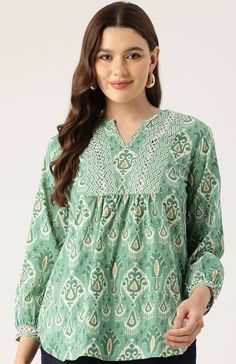 Green & White unique Jaipuri Cotton Print handmade top,features 3/4th sleeves and is mid length. extremely stylish and comfortable for every occasion,looks amazing with shorts or denims.This blouse is comfort & stylish .refer to the size chart or drop us a message if you need assistance. The beautiful detailing on the neck with the hand done embellishing and lace add a vintage boho chic look , while the print is eye catching as well  Model is wearing size S Also available in  S,M,L,XL Size chart Summer Tunic Tops With Printed Motifs, Summer Tunic Blouse With Printed Motifs, Casual Long Sleeve Blouse With Printed Motifs, Spring Tunic Blouse With Printed Motifs, Green Printed Half Sleeve Blouse, Summer Casual Straight Kurta Blouse, Spring Straight Kurta Blouse With Printed Motifs, Casual Green Straight Kurta Top, Summer Kurta Blouse With Printed Motifs