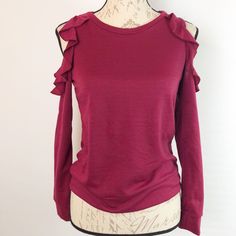 Cute Top With Ruffles Cutout Shoulder. New With Tags! 90% Polyester 7% Rayon 3% Spandex Approx Measurement Length 22 Inch Pit To Pit 17 Inch Casual Burgundy Knit Top, Cutout Sweater, Measurement Length, Burgundy Color, Cute Tops, Ruffles, Scoop Neck, Knitted Sweaters, Sweaters For Women