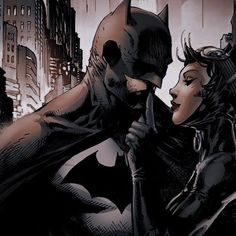 batman and catwoman kissing in the city