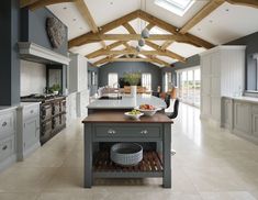 a large kitchen with an island in the middle