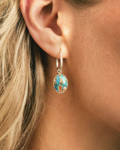 Oval oyster copper turquoise gemstone earrings set in sparkling sterling silver. These earrings will allow you to take the ocean with you wherever you go as the unique gemstones have ethically harvested real oyster shells. These gems are truly a unique blend of water and earth magic! Plus, with a leverback closure, these beauties will always stay secure.

#turquoisejewelry #turquoiseearring #oystercopperturquoise #oysterturquoise #mermaidvibes Turquoise Gemstone Earrings, Turquoise Earrings, Unique Earrings