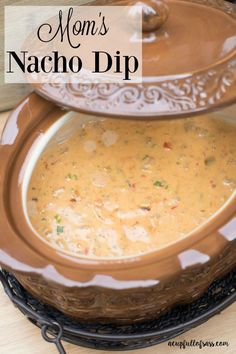 two servings of nacho dip on a platter with the words mom's nacho dip above them