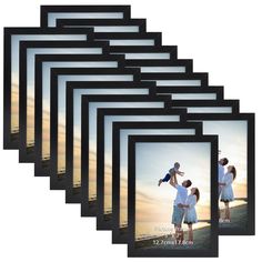 a set of six black and white photo frames with an image of a man holding a child