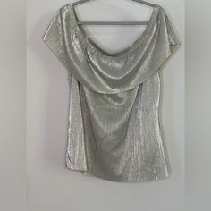 This Is A New With Tag A.N.A. Brand Off-Shoulder Silver Metallic Blouse. This Has A Metallic Foil Look To It And I Think It’s Perfect For A Party Or Holiday Celebration! It’s A Size Xl. Short Sleeve Tops For Night Out Holiday, Chic Short Sleeve Blouse For Party Season, Short Sleeve Blouse For Party Season, Glamorous Short Sleeve Blouse For Party, Off-shoulder Tops For Summer Formal Events, Off-shoulder Tops For Formal Summer Events, Elegant Short Sleeve Tops For Party Season, Metallic Tops For Festive Summer Occasions, Elegant Short Sleeve Tops For Party