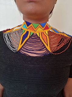 African wedding necklace, Zulu necklace, Beaded shawl necklace, African jewelry, Masai necklace, Bridesmaid necklace, Wedding gift This stunning necklace is superbly crafted with fine beads. The necklace can be worn with any outfit at different occasions and it will absolutely makes you stand out. 100% handmade using fine beads. Closure: ball joint Color: Multicolor 3-5 days delivery via DHL Express The shipping fee is for the first item only and additional necklaces or items ship for free. BROW Multicolor Beaded Choker For Wedding, Bohemian Colorful Beads For Wedding, Wedding Multicolor Beaded Chain Beads, Multicolor Handmade Choker For Wedding, White Beaded Choker For Festivals, Bohemian Multicolor Beaded Necklaces For Wedding, Multicolor Beaded Chain Necklace For Wedding, Bohemian Multicolor Beaded Necklace For Wedding, Bohemian Beaded Necklaces For Wedding