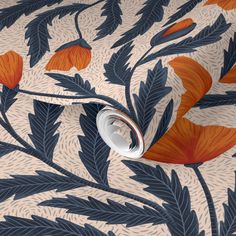 an orange and blue floral wallpaper with leaves on the side, in front of a white background